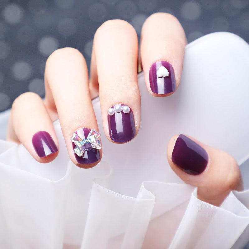 Wearing Nails With Diamonds And Purple Fake Nails - MAXIME