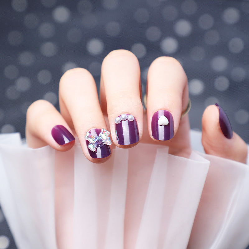 Wearing Nails With Diamonds And Purple Fake Nails - MAXIME